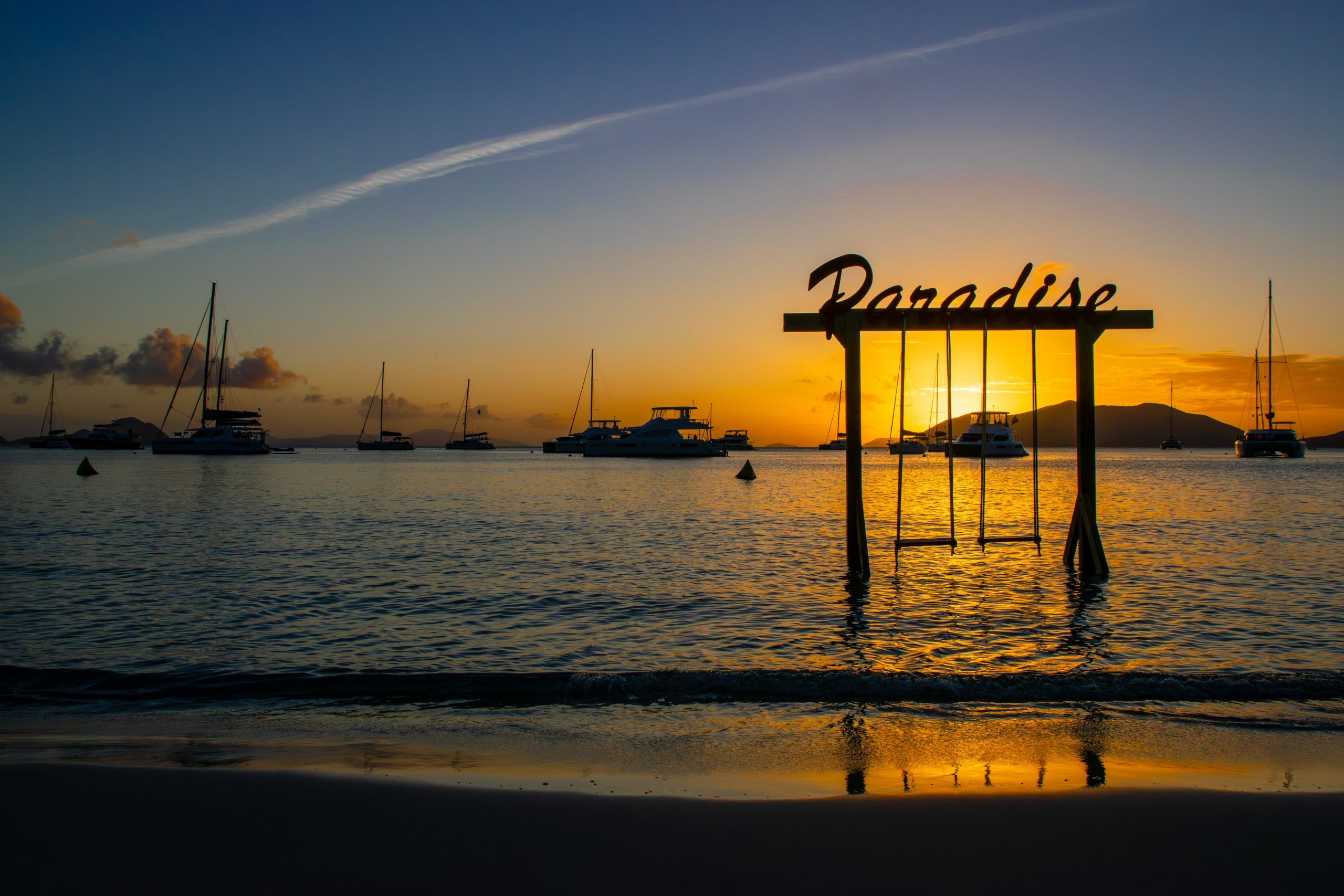 Sunset on the beach with boats